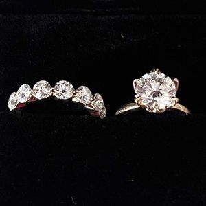 2 ct Moissanite round solitaire engagement &
1 ct tw (I think!) wedding band 10k